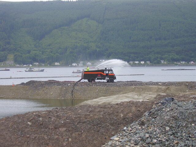 Sandbank marina Ex Army Green Goddess pumping sea water from land reclaimed from the sea. When complete this will greatly extend Holy Loch marina.