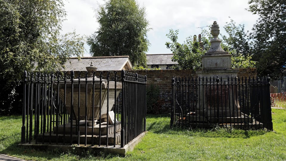 Fenced finial-ed table tombs in St Peter's churchyard in the village of St Peter's in the civil parish of Broadstairs and St Peter's in Kent, England. Software: RAW file lens-corrected, optimized and converted to JPEG with DxO OpticsPro 10 Elite, and likely further optimized and/or cropped and/or spun with Adobe Photoshop CS2.