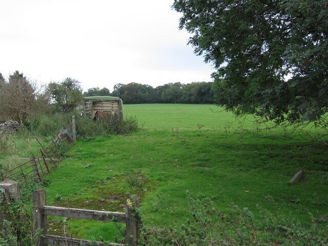 Looking east along the right of way The derelict byre looks like part of a lorry that was recycled.