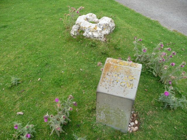 Croes Antoni (detail) The base of the medieval roadside cross can be seen here.