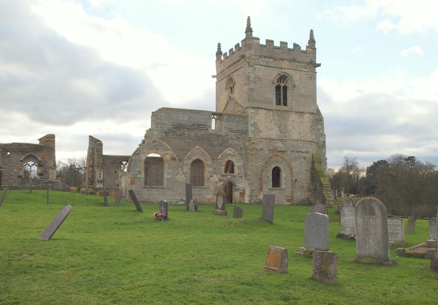 St Mary's Church, Colston Bassett, Notts. North facing aspects of this former parish church. The ruins stand on a low rise approximately one kilometre north-east of Colston Bassett and the church dates from 1130. The depopulation of the Wolds apparently led to a decline in the size of its congregation and by 1744 the church had fallen into a state of disrepair. The church was never de-consecrated and in July 2005 a service of re-dedication was held in the ruins following some restoration work aimed at preserving its remains. It is a scheduled Ancient Monument and is Grade I-listed.