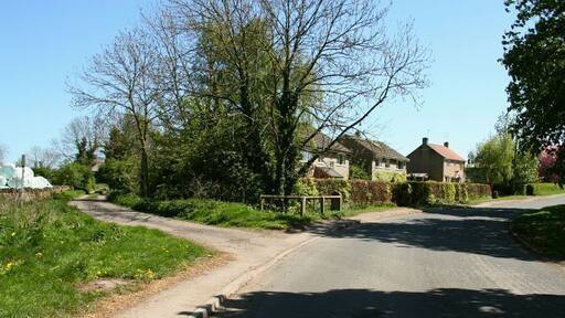 Ings Lane. Ings Lane (further south called Brompton Ings Road) connects Brompton By Sawdon with High Street, Sherburn (A64). This photograph is looking in a southerly direction from near Brompton Butts (behind and right of the viewpoint). The lane on the left is Acres Lane. A public footpath follows this lane to its end and then crosses fields in an easterly direction to Hudgin Lane near Wykeham Abbey. For a more southerly (ahead) photograph of Ings Lane, click here 430777. For a photograph of Ings Lane taken from approximately the same viewpoint but looking in the opposite (northerly) direction, click here 430709.