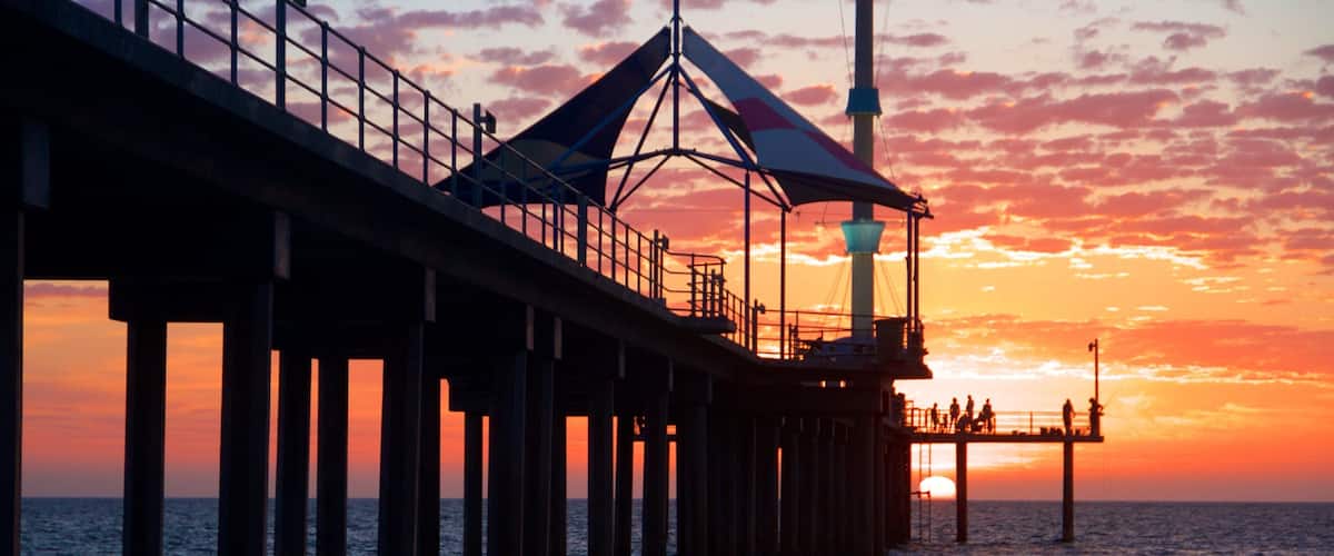 Adelaide which includes general coastal views, views and a sunset