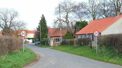 Scorton - the old road to Catterick. The 1940s map clearly shows that the B6271 left Scorton by the north-west corner of the green. This has now been replaced by a new road leaving the village to the south-west, leaving the pictured road as a cul-de-sac. Looking east.