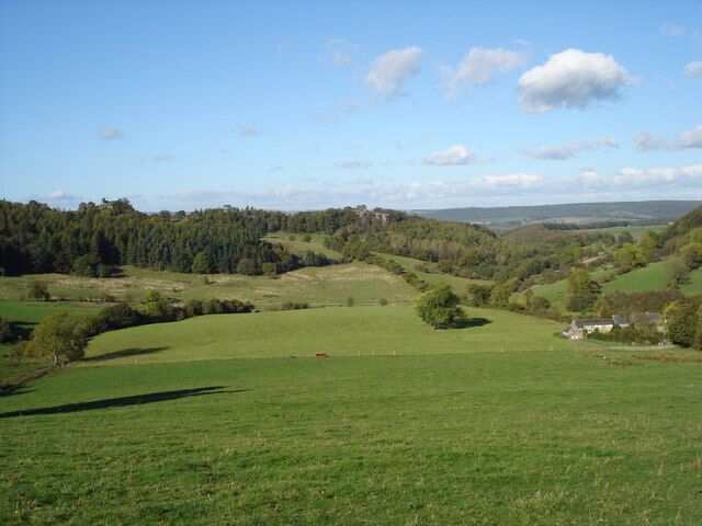 Ancient Landscape From this footpath there is a fine view to Dudwood, a name mentioned in documents in the late 1500's. The houses, bottom right stand by Dudwood Lane, which is also the Limestone Way long distance path, and date from 1737, (on an engraved plaque).