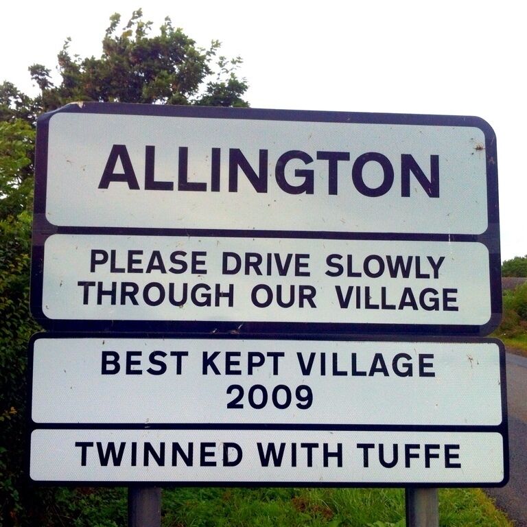 A village sign with 'Allington' and 'Best Kept Village 2009' text.