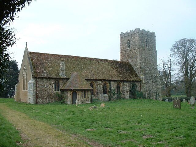 A church with a tower and a graveyard.
