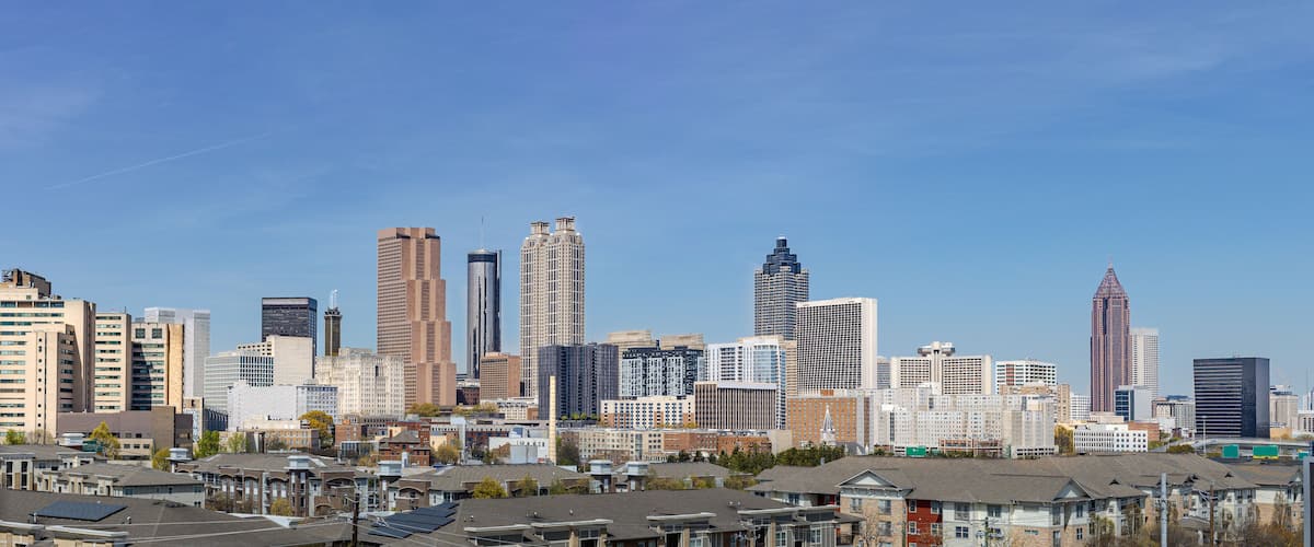 A city skyline with various high-rise buildings and residential areas.
