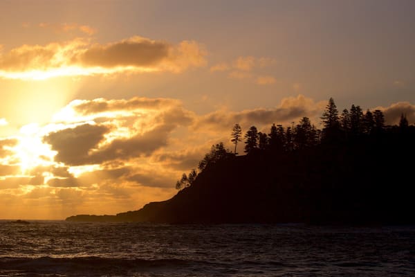 Norfolk Island which includes general coastal views and a sunset