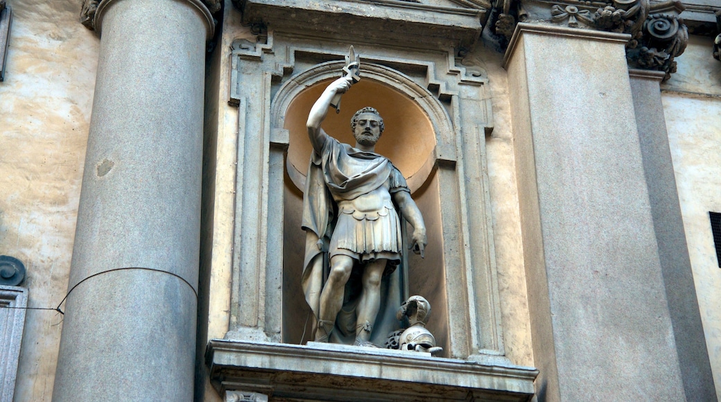 Chiesa di San Maurizio which includes heritage architecture and a statue or sculpture