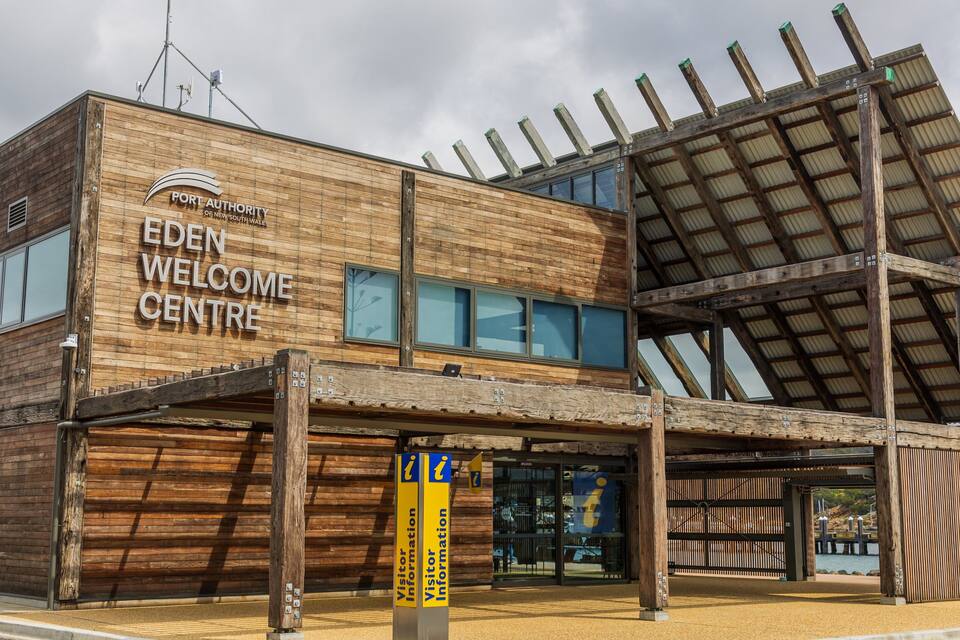 A wooden building with the sign 'Port Authority of New South Wales Eden Welcome Centre'.