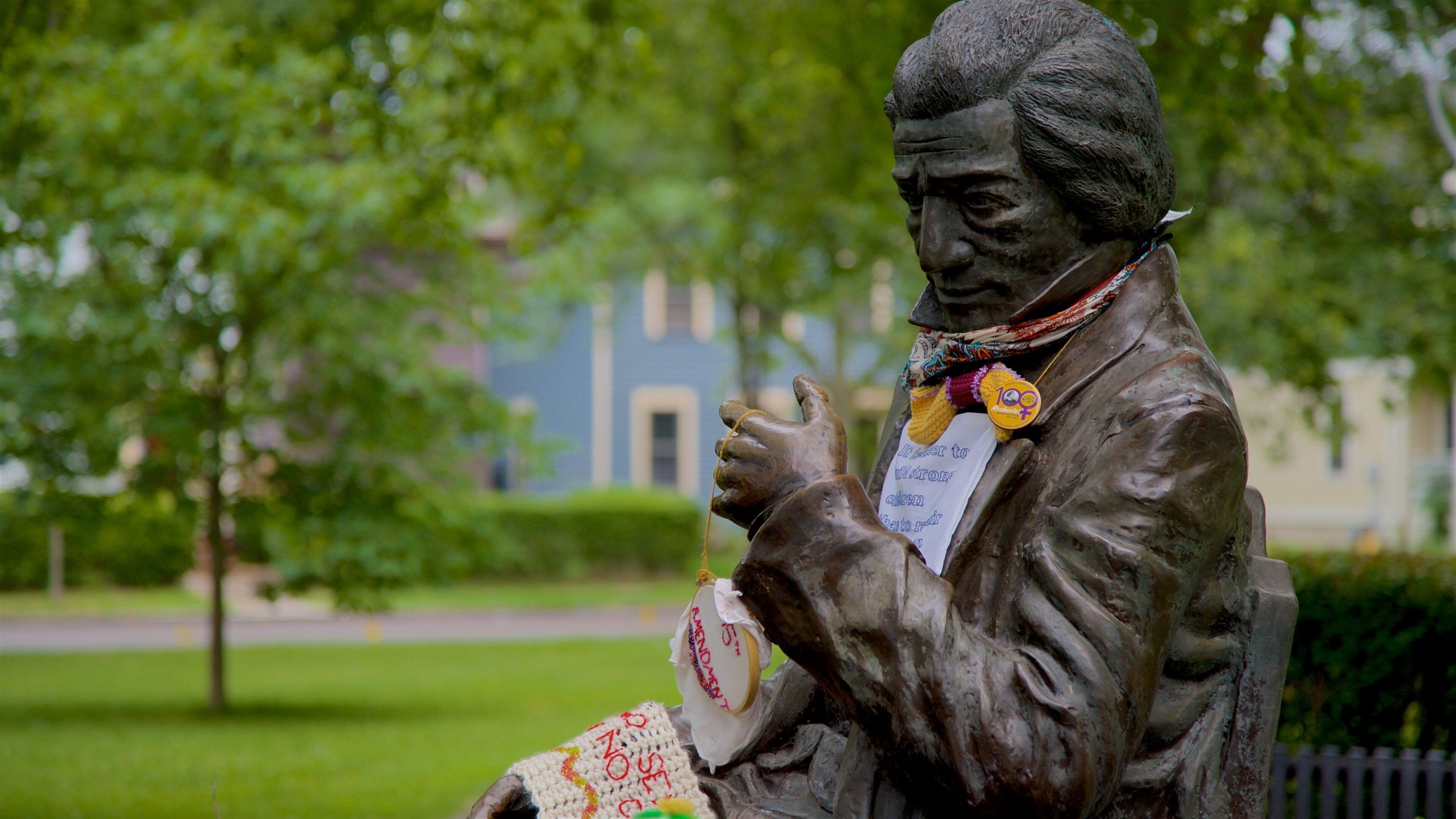 Susan B. Anthony Square which includes a garden and a statue or sculpture