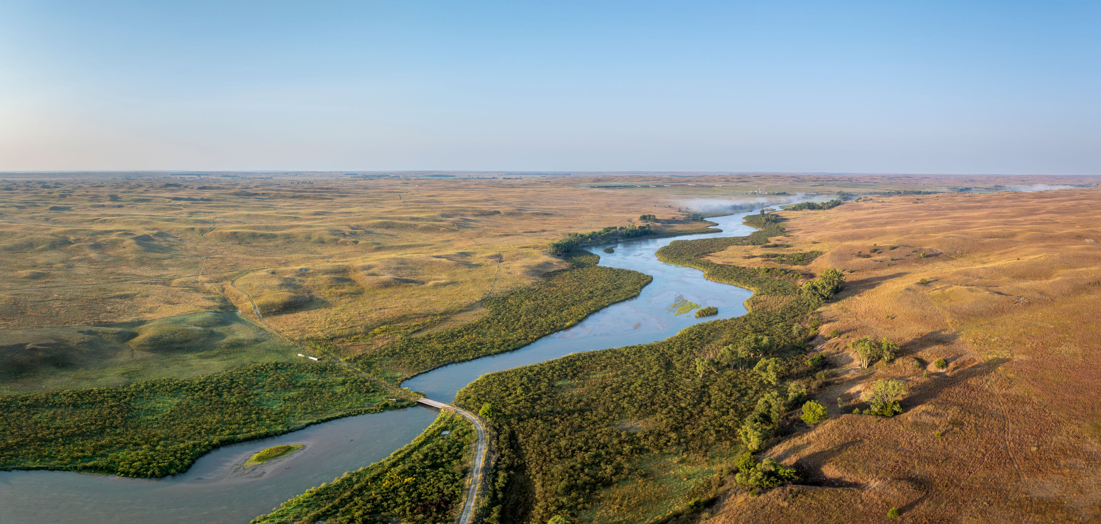 aerial panorama of the Dismal River and Nebraska Sandhills at Nebraska National Forest, late summer morning scenery