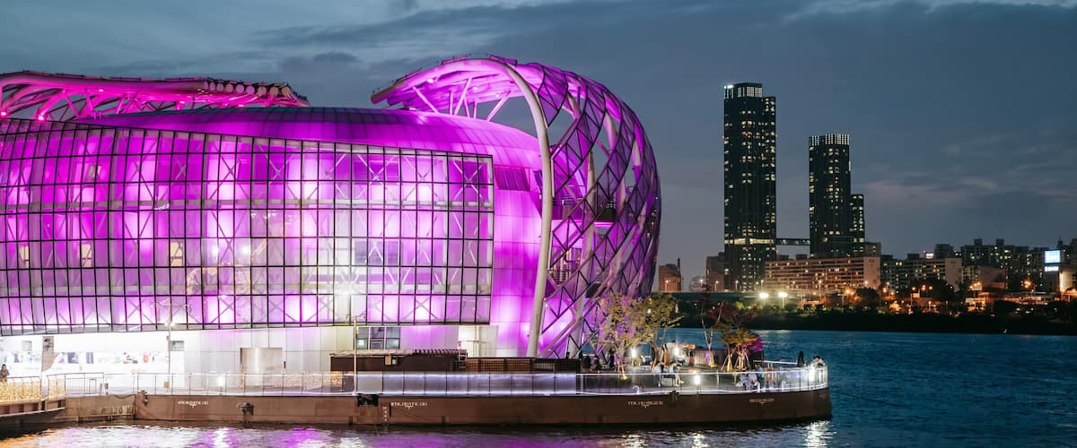 Banpo Hangang Park which includes a bay or harbor, modern architecture and night scenes