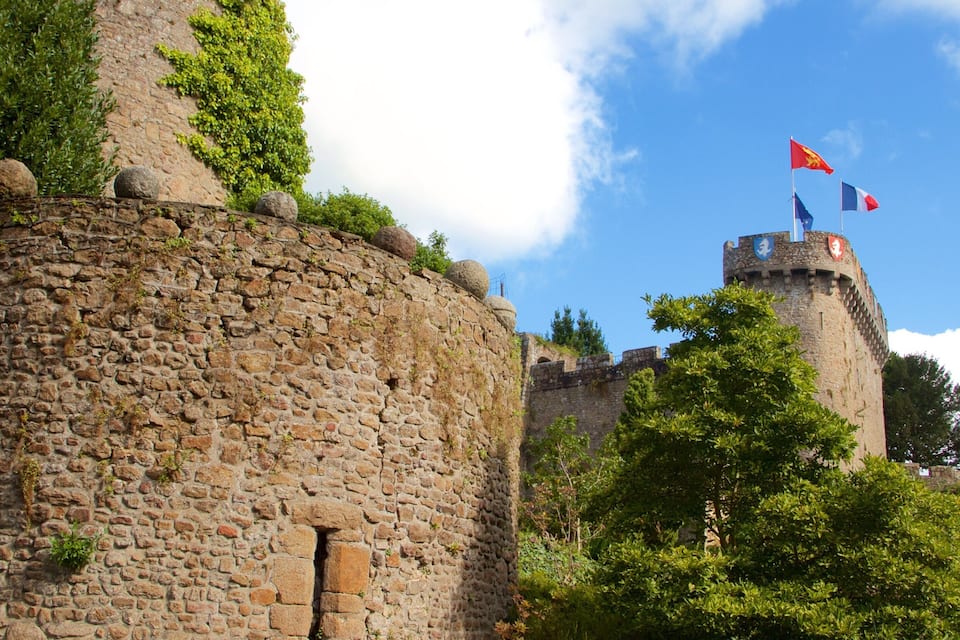 A stone castle with a flag on top.