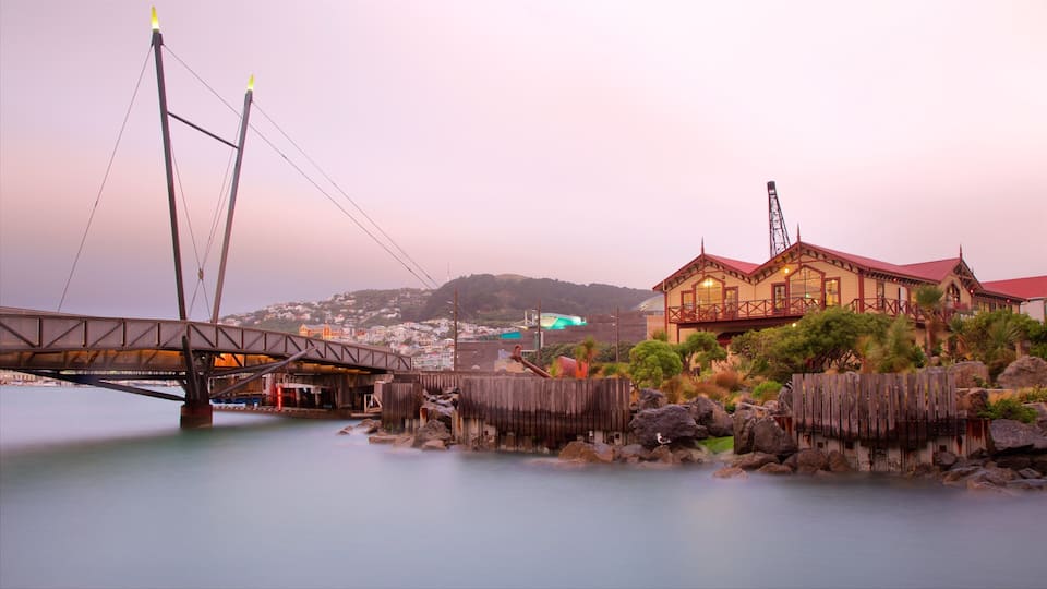 Wellington Waterfront featuring a bridge, a sunset and a river or creek