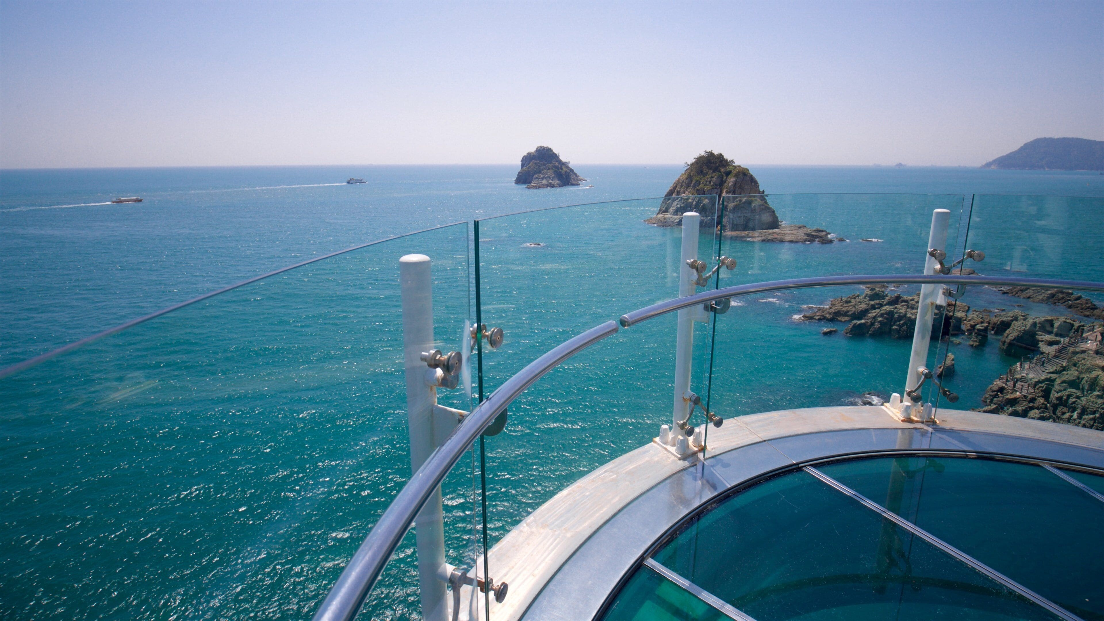 Busan showing rugged coastline, island views and general coastal views