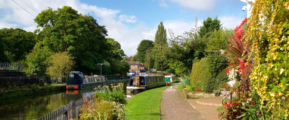 Lymm which includes a river or creek, wild flowers and a park