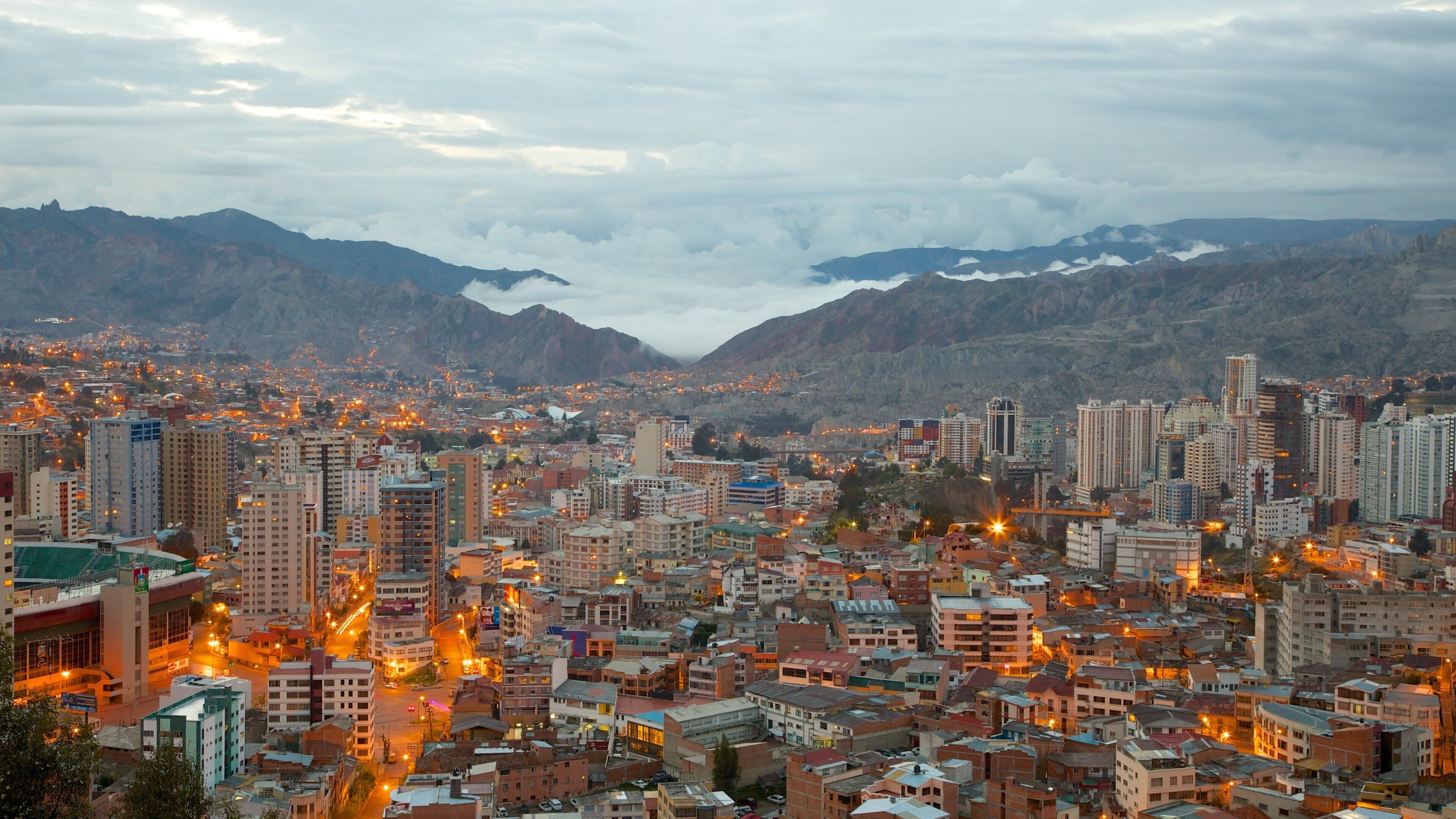 A cityscape with a mountainous backdrop.