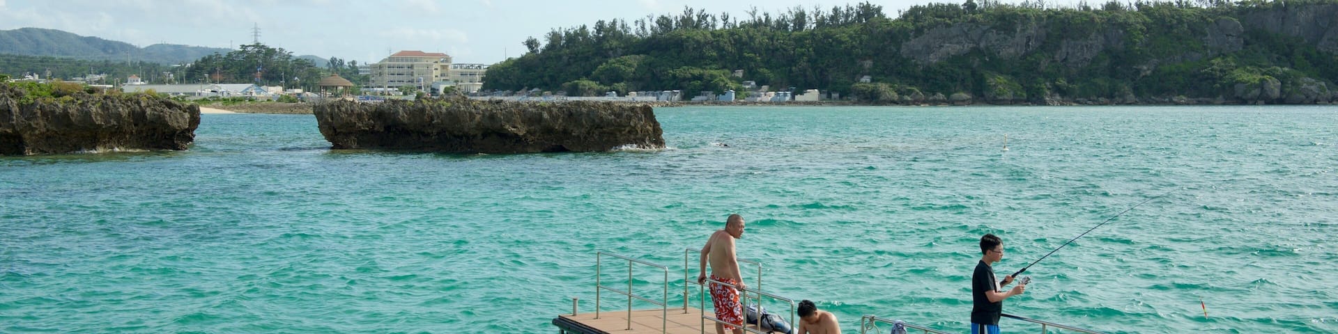 Okinawa which includes general coastal views and fishing