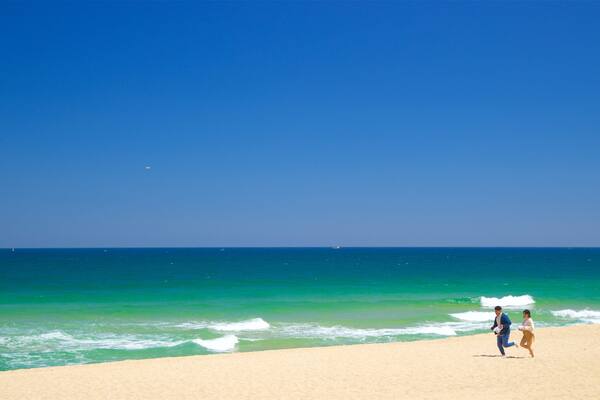 Gyeongpo Beach featuring a beach and general coastal views as well as a couple