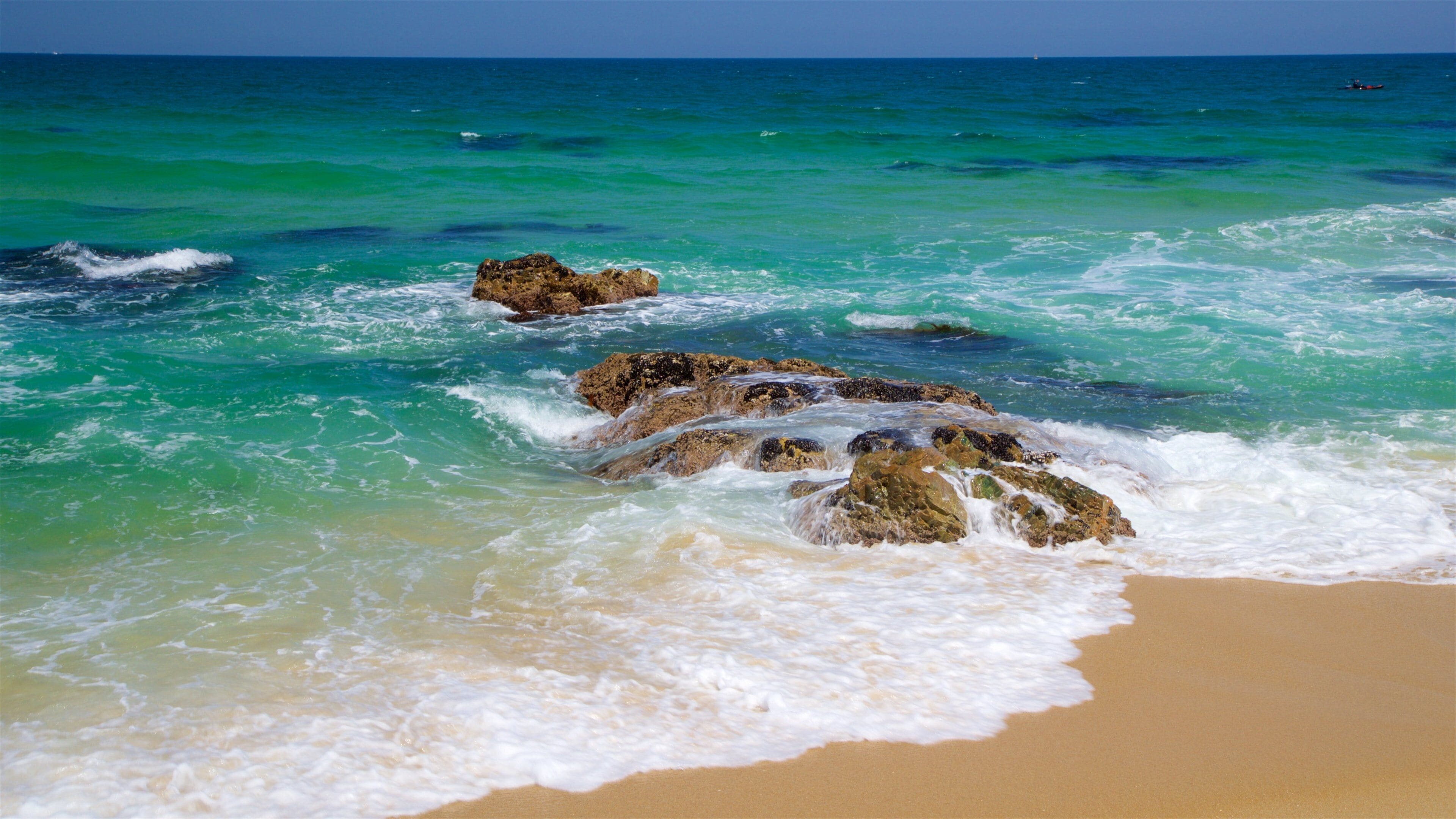 Gyeongpo Beach featuring rugged coastline, a sandy beach and general coastal views