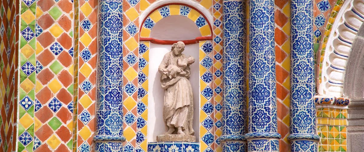 Templo San Francisco Acatepec showing religious elements and a statue or sculpture