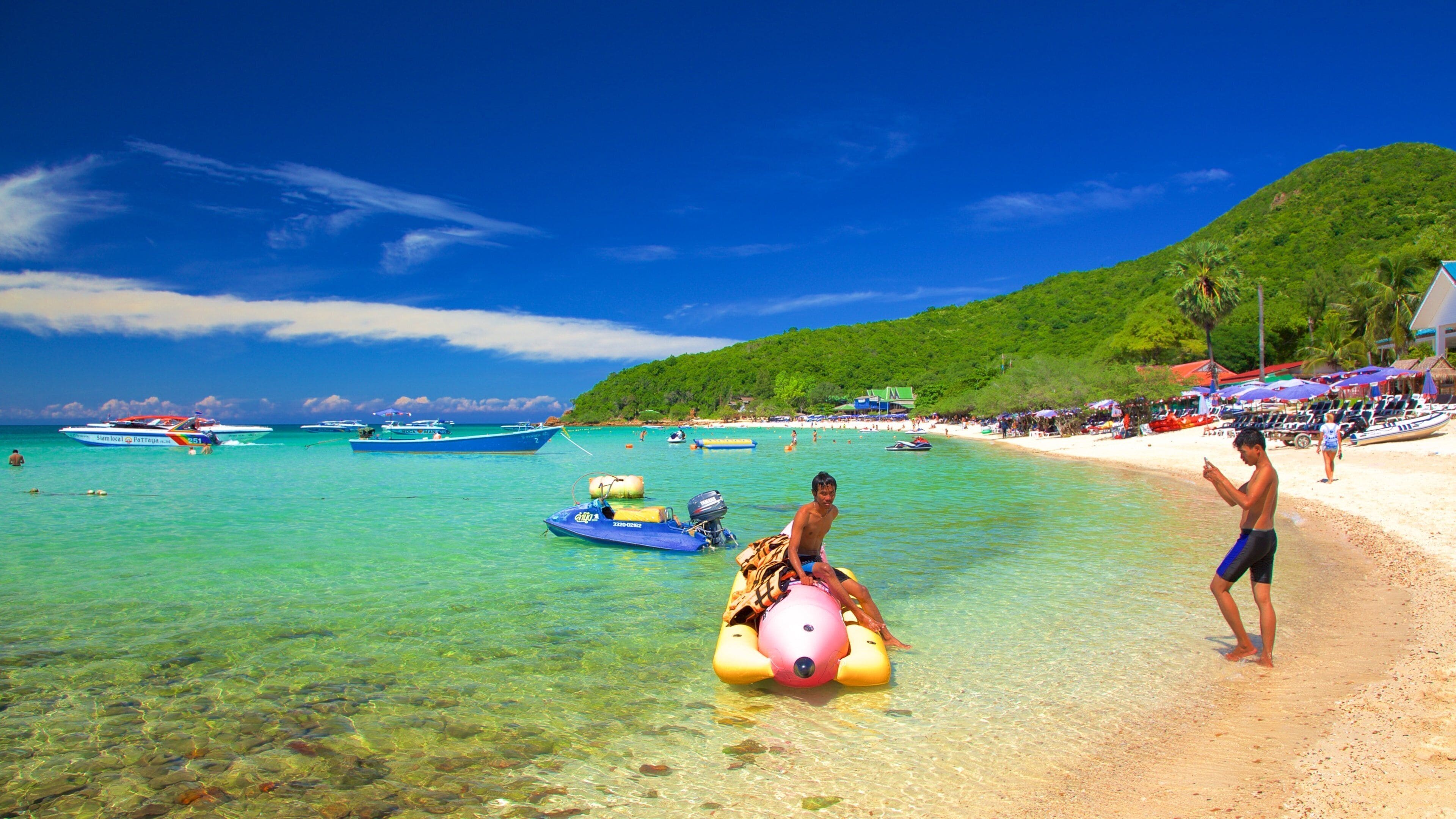 Koh Lan featuring boating and general coastal views as well as children