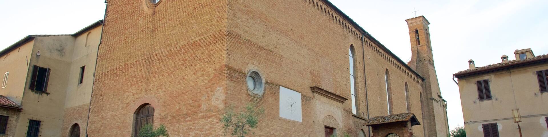 A historic church with a bell tower, arched windows, and a brick facade.