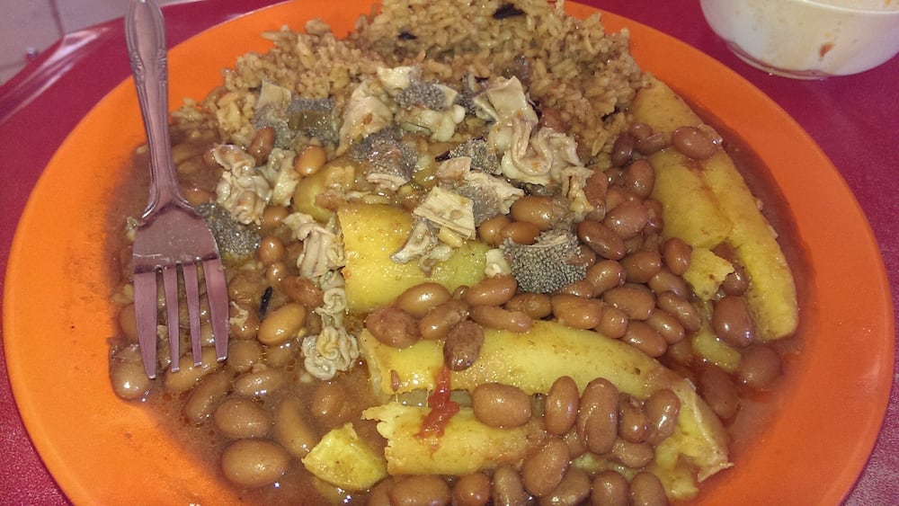 Breakfast of Champions in Uganda. Beans, Rice, Matoke....and animal intestines! God help me !!!!!