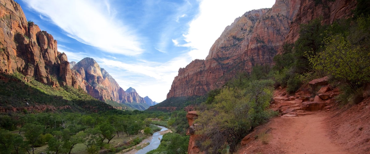 Zion National Park featuring mountains, a river or creek and a gorge or canyon