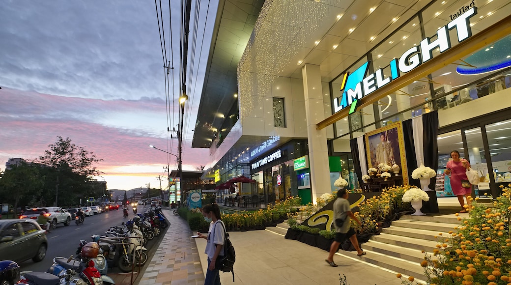 A young Thai girl stands outside Limelight Avenue, a shopping center in Phuket Town, Phuket, Thailand; taken just before sunset