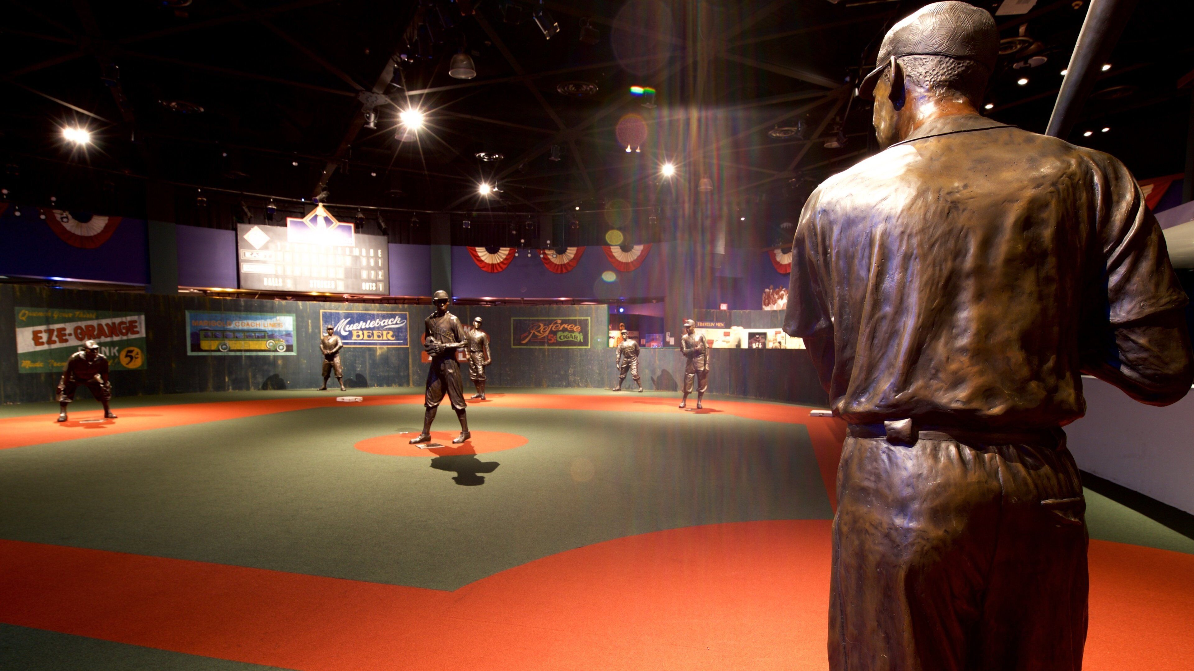 Negro Leagues Baseball Museum showing a statue or sculpture and interior views