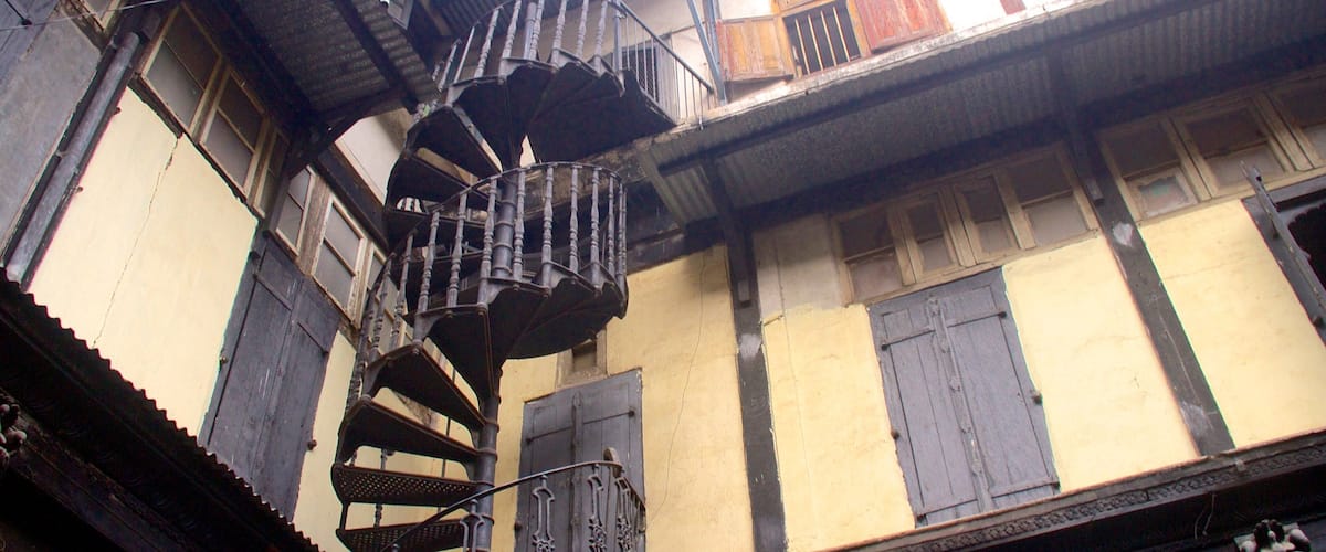 Pune which includes heritage architecture and a house