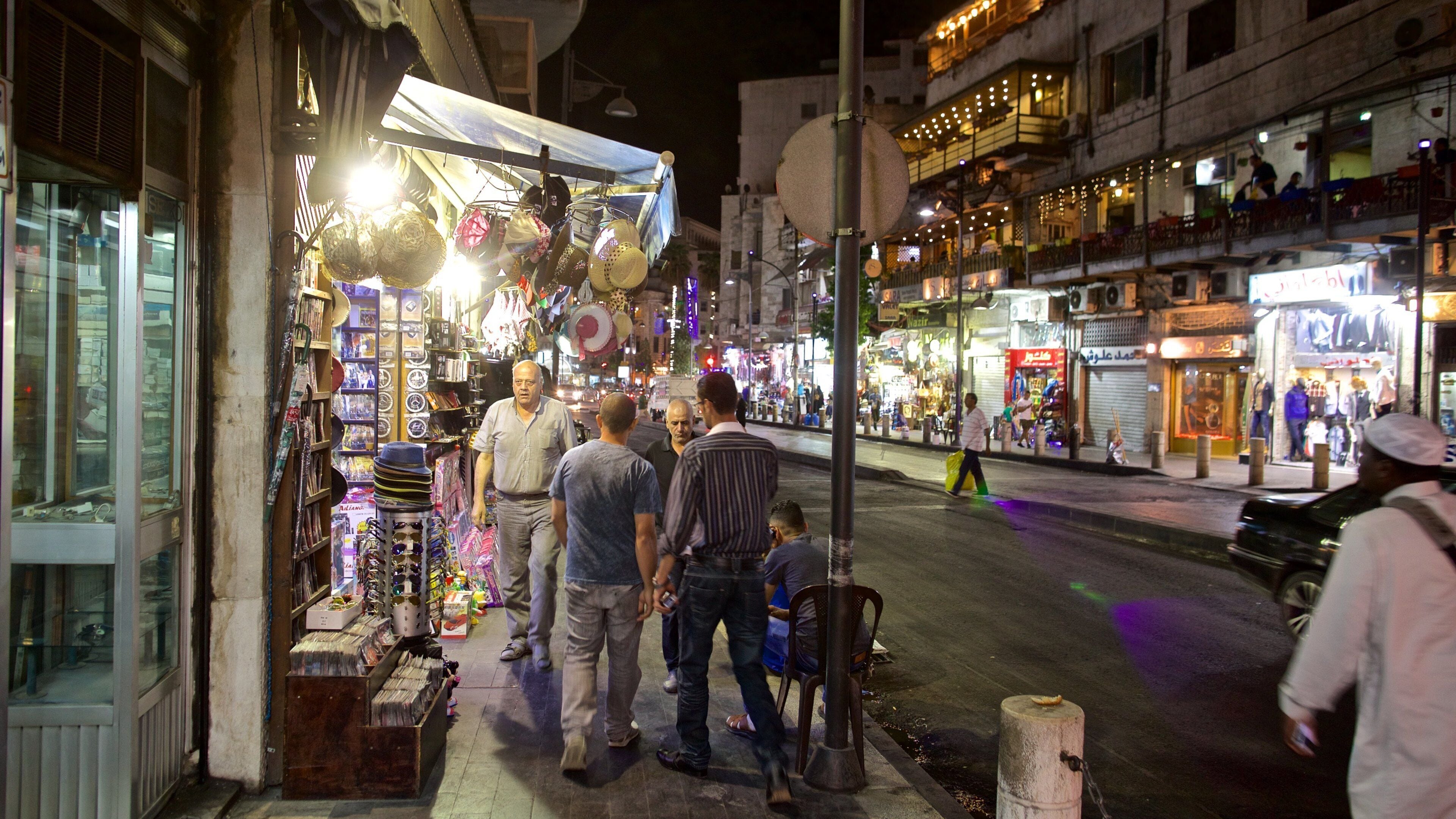 Amman showing night scenes and street scenes as well as a small group of people