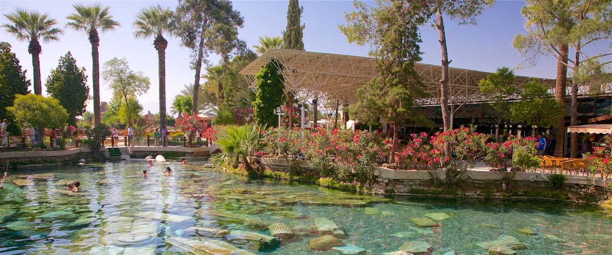 Hierapolis featuring a pool and a hot spring as well as a small group of people