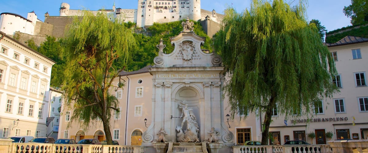 Salzburg which includes a city, a fountain and a pond