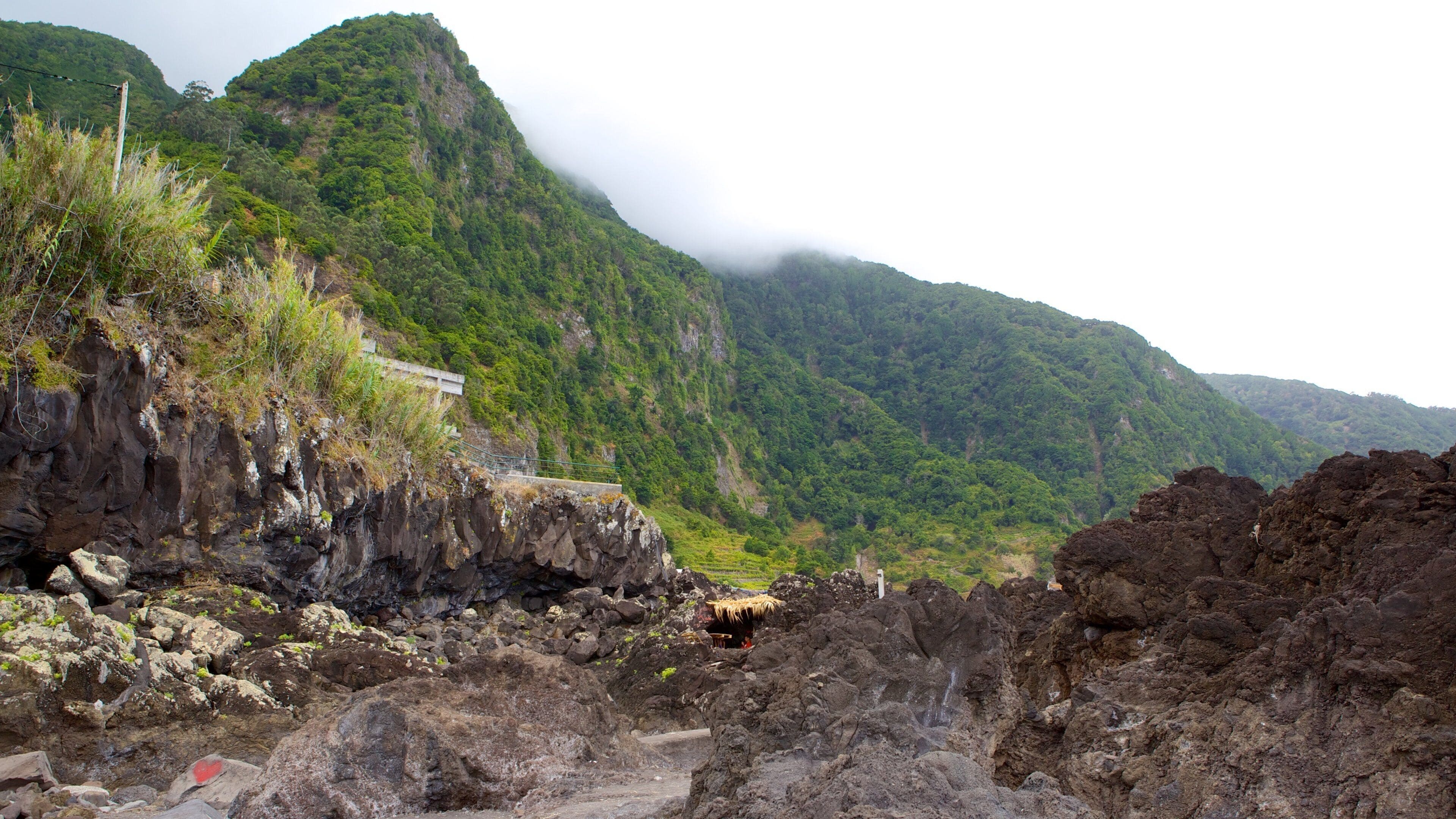 Madeira Island which includes mist or fog and mountains