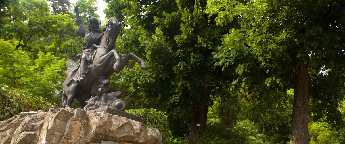 Grenoble featuring a park and a statue or sculpture