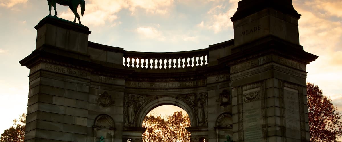 Philadelphia which includes heritage elements, a sunset and a statue or sculpture