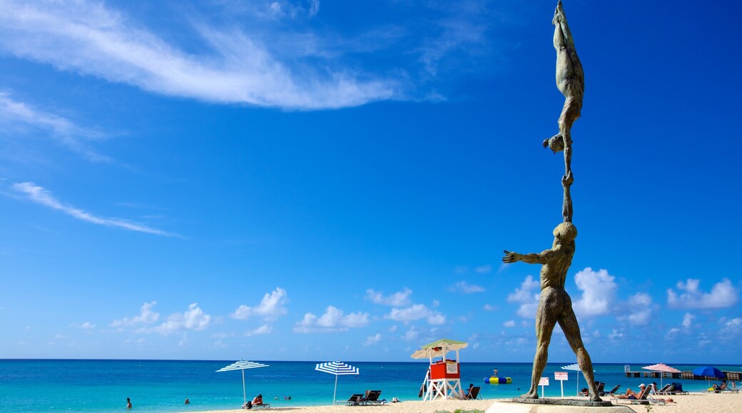 Doctor\'s Cave Beach featuring a sandy beach, outdoor art and a statue or sculpture