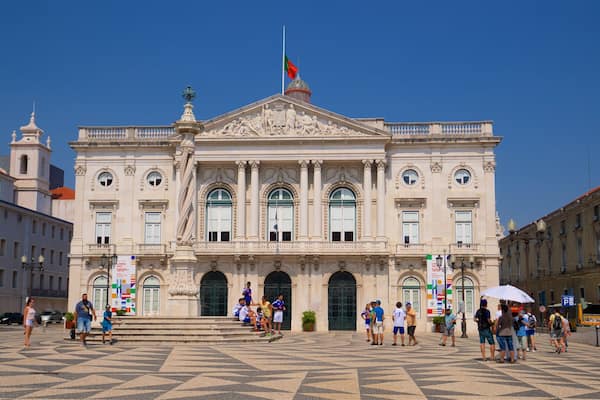 Lisbon District featuring heritage architecture and a square or plaza as well as a small group of people