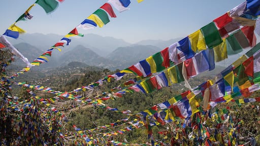 Colorful prayer flag mountain near ancient and holy Namobuddha monastery. Dhulikhel, Nepal.