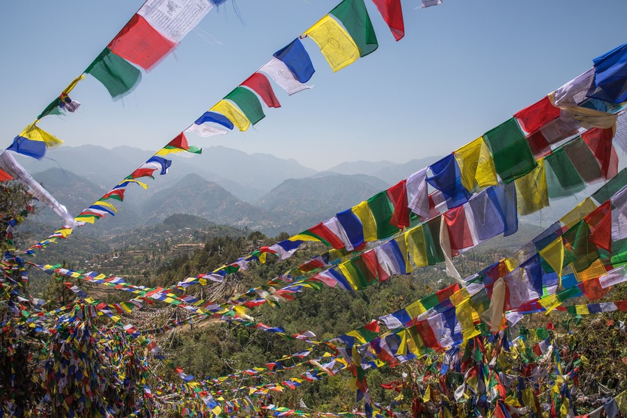 Colorful prayer flag mountain near ancient and holy Namobuddha monastery. Dhulikhel, Nepal.