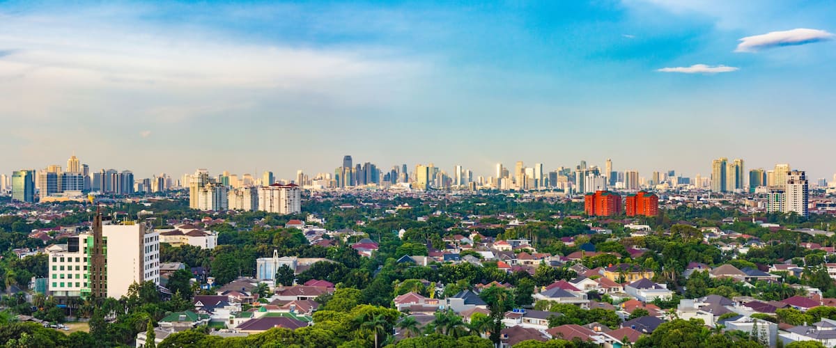 Jakarta, Indonesia - 30th December 2018: Panorama photo of South Jakarta cityscape, taken at sunset. This region is famous for luxury houses and apartments for rich people.