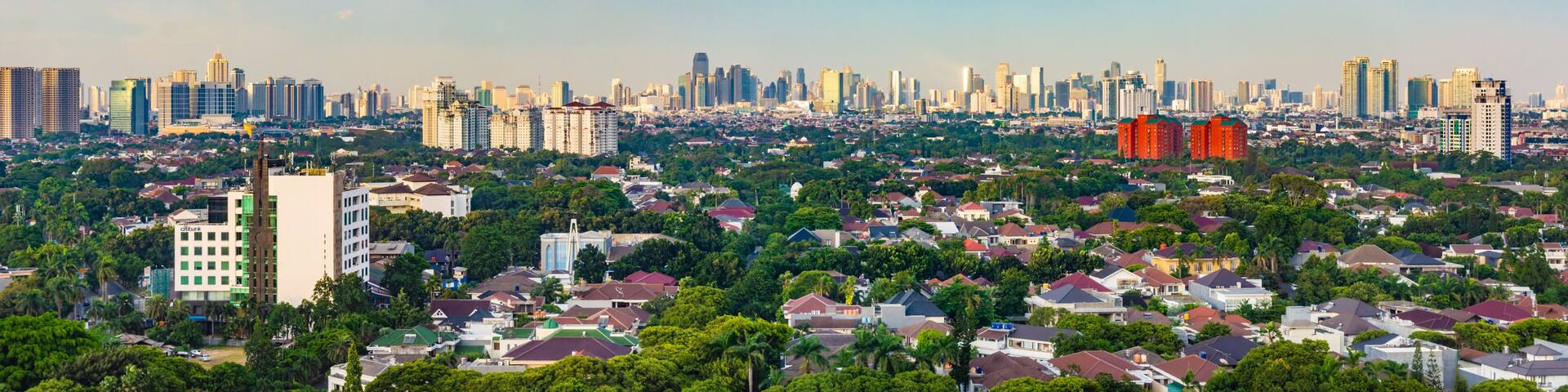 Jakarta, Indonesia - 30th December 2018: Panorama photo of South Jakarta cityscape, taken at sunset. This region is famous for luxury houses and apartments for rich people.