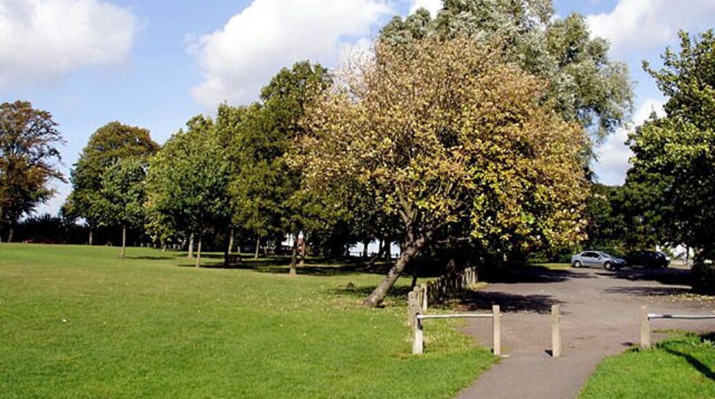 Ardagh Tennis Courts Car Park. The car park for the tennis courts and the access road leading upto Kellaway Avenue, lined by trees..