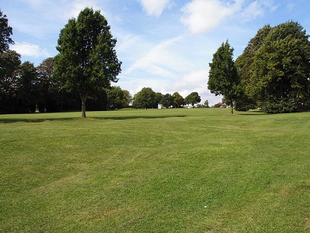 Horfield Common looking towards Kellaway Avenue. Standing near the bottom of the hill looking up (and across a grid line which is nearly at the top) towards Kellaway Avenue which runs along the top. The tennis courts are behind the line of trees on the left.