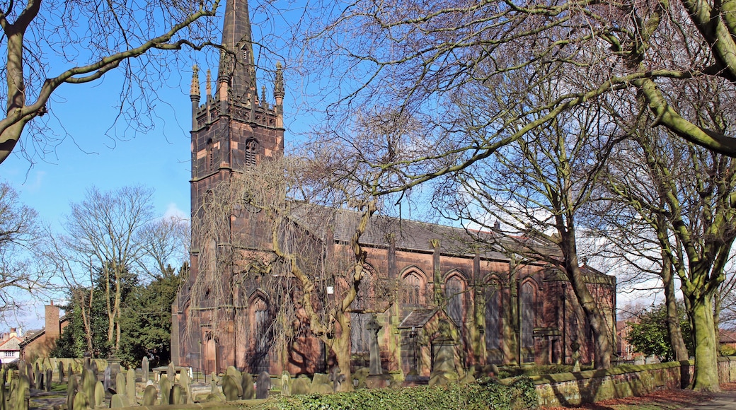 Grade II listed stone church in Knotty Ash, Liverpool, dating to 1835 with chancel and side chapel added 1890. in mixed, but compatible styles by Aldridge & Deacon.Seen from Brookside Avenue near junction with Thomas Lane.