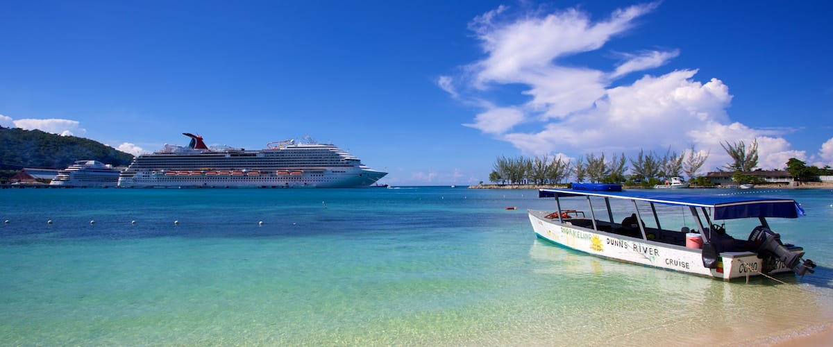 Ocho Rios which includes general coastal views, boating and a sandy beach